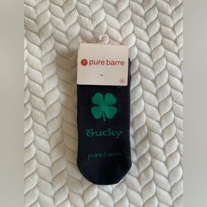 Pure Barre “Feeling Tucky” Black and Green Grip Socks with Green Clover Design